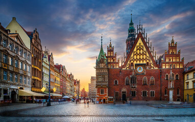 Fototapeta premium Wroclaw central market square with old houses and sunset. Panoramic evening view, long exposure, timelapse. Historical capital of Silesia, Wroclaw (Breslau) , Poland, Europe.