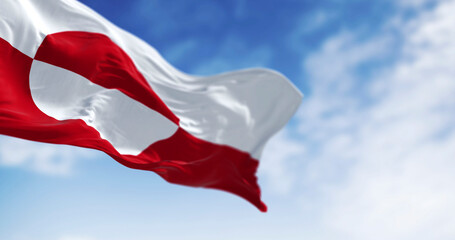 Greenland flag waving against clear blue sky, 3D render