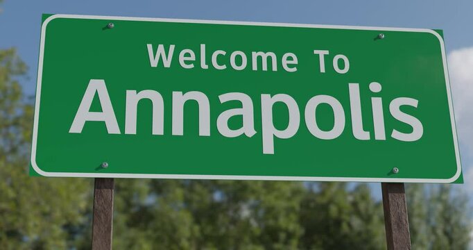 Driving By A Welcome To Annapolis, Maryland Green Road Sign Against a Blue Sky and Clouds - United States Capital Series.