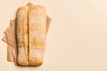 Fresh ciabatta bread on napkin on rustic background, Italian bread top view