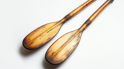 A pair of wooden kitchen utensils on a white background, showcasing rustic charm and functionality for culinary enthusiasts
