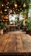 Rustic wooden table in a cozy cafe with hanging lights and green plants creating a warm inviting atmosphere and blurred background