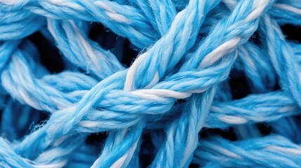 Close-up of interwoven light-blue and white cords