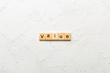 value word written on wood block. value text on table, concept