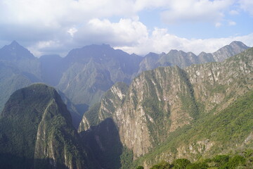 Stunning views over the old historic ruins of Machu Picchu in the Andes Mountains cloud forests of Peru