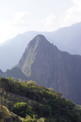 Stunning views over the old historic ruins of Machu Picchu in the Andes Mountains cloud forests of Peru