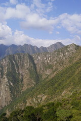 Stunning views over the old historic ruins of Machu Picchu in the Andes Mountains cloud forests of Peru