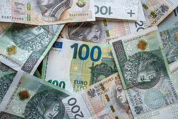 100 euro banknote with 100 200 PLN Polish zloty finance background