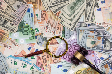 Judge gavel on dollars and euro banknotes
