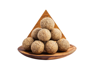 A pile of flax seed laddus on a wooden plate, Sweets laddu on Png Format and Transparent Background
