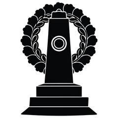 a poppy wreath resting on a marble war monument