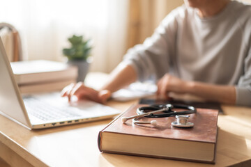 Medical Student Studying Human Anatomy In Modern Library For Advanced Healthcare Education And...
