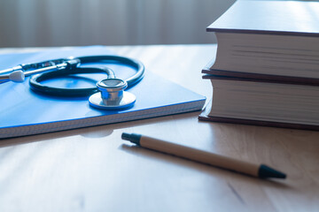 Medical Notepad And Stethoscope On Doctor’s Desk In Hospital, Emphasizing Professionalism And...