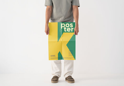 Mockup Of Man Holding Customizable Poster, Low Section