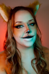 Model with makeup reminiscent of an orange fox.