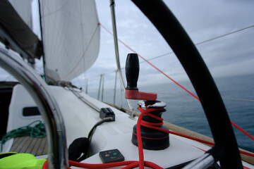A view on a sailing yacht with winches and lines prepared to control the  lines and sails © david