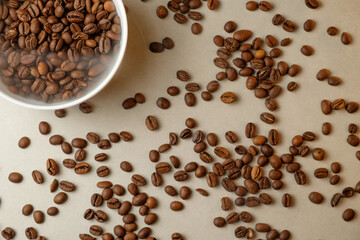 Aromatic coffee beans scattered on a smooth surface in a cozy kitchen