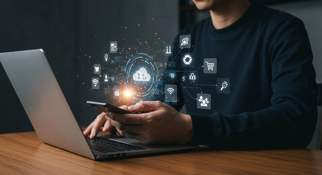 Person using laptop and smartphone with cloud computing and digital technology interface