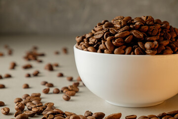 Freshly roasted coffee beans in a white bowl perfect for brewing