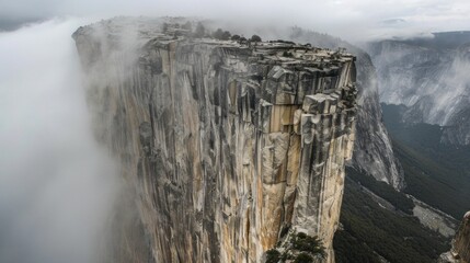 Majestic cliffside shrouded in ethereal mist, revealing natures grand scale