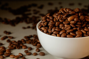 Freshly roasted coffee beans creating a rich aroma in a cozy café setting