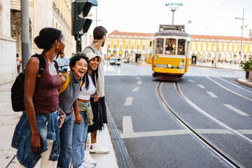 Tourists waiting for tram in lisbon, portugal, europe