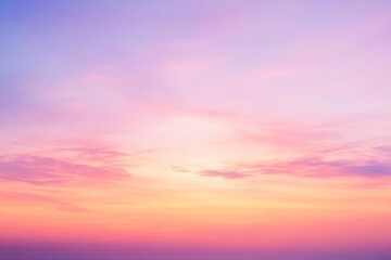 Fototapeta premium Evening sky displays warm hues of pink and orange at sunset by the horizon