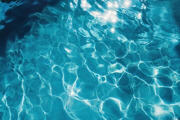 Fototapeta premium Transparent blue water reflecting light in a serene aquatic environment