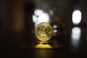 Close-up of Shiny Bitcoin Coin in Focus with Blurred Background