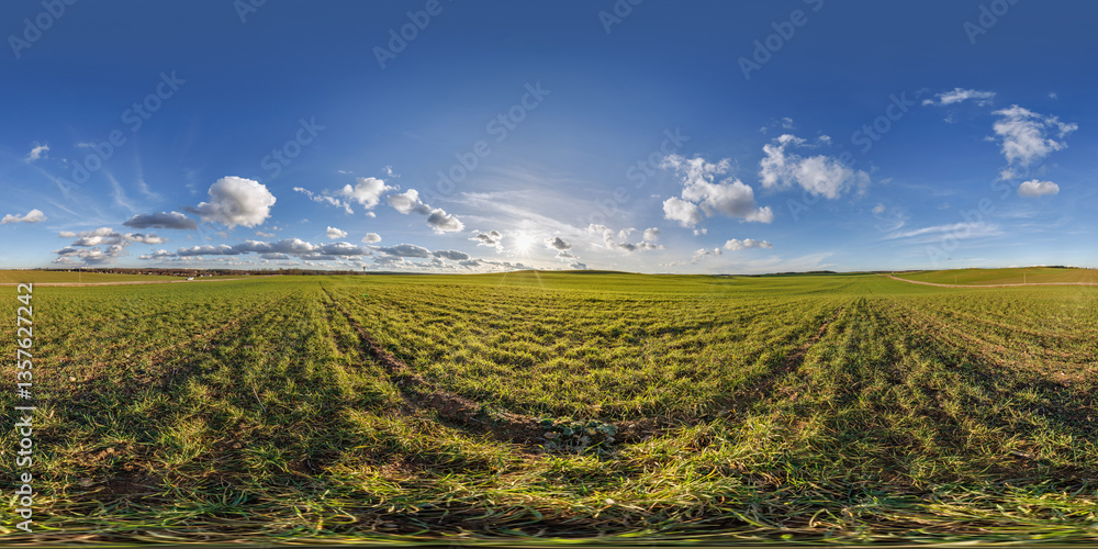 Wall mural spherical 360 hdri panorama on agro field with clouds and sun on blue sky in equirectangular seamles