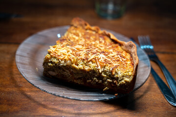 Sideview of a slice of a vegetarian pie on a glass plate