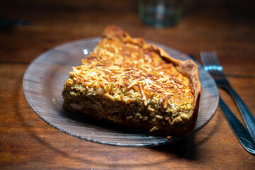 Sideview of a slice of a vegetarian pie on a glass plate