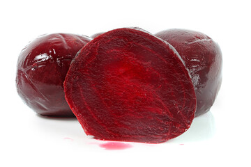 Close-up of a beetroot cut in half on a white background, highlighting its deep red color and fresh texture