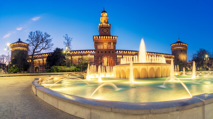 Sforza castle  ( Castello Sforzesco ) at night, amazing old medieval Italian castle with fountain illuminated, Milan , Italy. © robertobinetti70