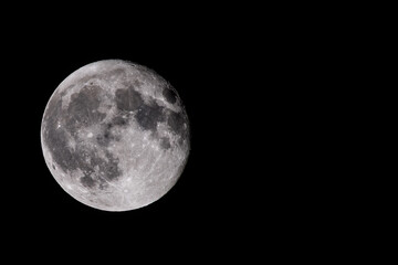Full moon in dark night sky