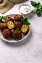 Middle Eastern falafel balls with sauce