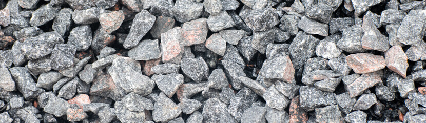 Natural rock texture background with rugged surface and earthy tones.