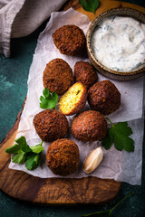 Middle Eastern falafel balls with sauce