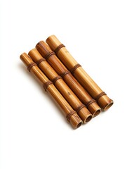 Four brown bamboo poles tied together on a white background. Studio shot