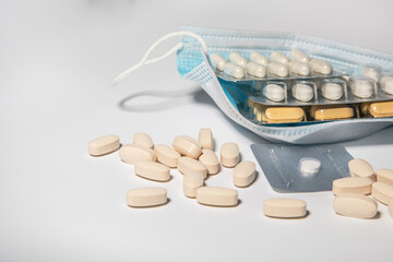 many pills from the virus on a light table. The concept is medical. Treatment and support of the body