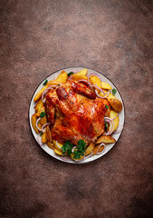 fried, baked chicken, in the oven, with spices, and rustic potatoes, top view, homemade,