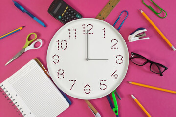 Wall clock showing 3:00 with office supplies, Clock and stationery for work-life balance, back to school, exam, meeting. Time management in study and study