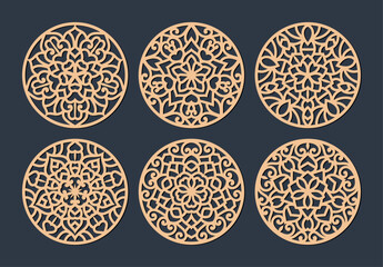 Laser cut patterned coasters, decorative round ornaments.	