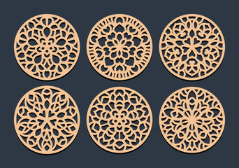Laser cut patterned coasters, decorative round ornaments.	