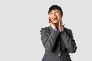Image of confident asian woman showing thumb up in approval, recommending, like smth good, standing...