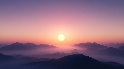 Obraz premium A tranquil sunrise illuminates misty mountains, casting soft colors across the horizon, creating a serene and peaceful atmosphere.