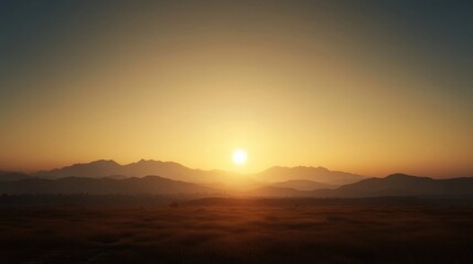 Obraz premium A tranquil sunset over a mountain range, illuminating the landscape with warm hues, creating a serene atmosphere.