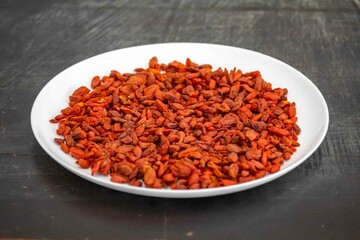The goji berry, also known as wolfberry pinyin, is the sweet fruit of Lycium barbarum or Lycium...