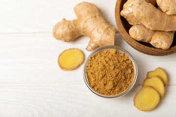 Fresh ginger on wooden background. Dry ginger. Sliced ​​ginger with honey and lemon. Ginger...
