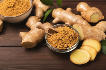 Fresh ginger on wooden background. Dry ginger. Sliced ​​ginger with honey and lemon. Ginger...